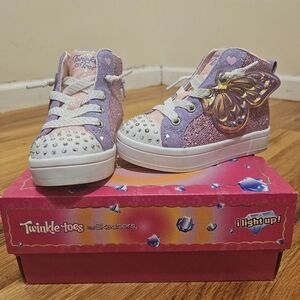 Purple and pink Twinkle Toes light-up sneakers. Toddler size US 7